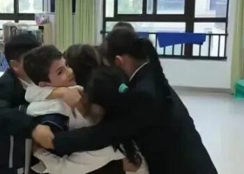 An Eight-Year-Old Iranian Boy Reunites with His Chinese Classmates After Weeks of Separation